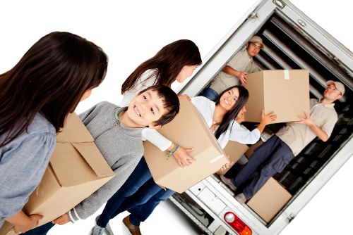Moving team preparing items safely before loading the van