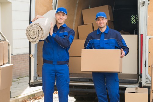 Crew securing furniture inside a removal van