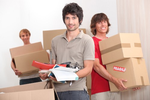Professional movers handling flat access and packing in Poplar