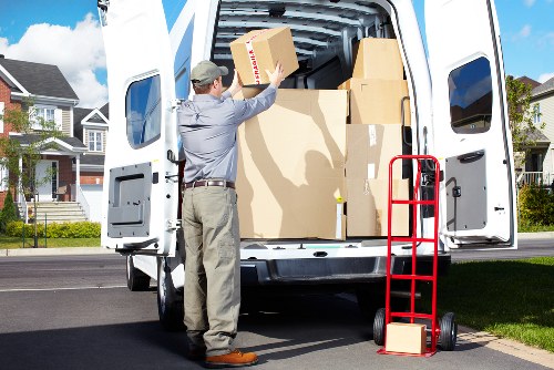 Local removal van helping with boxes and appliances in Poplar