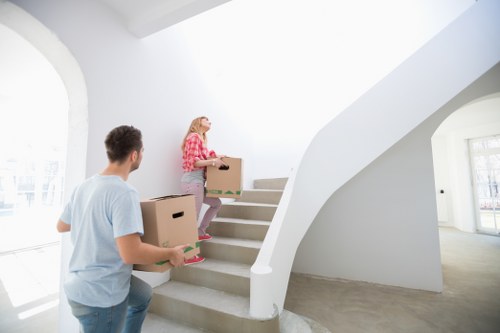 Packed boxes and furniture ready for home removals in Poplar