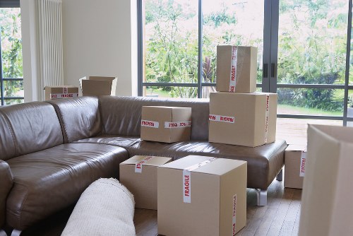 Office and business items being moved by a man and van team in Poplar